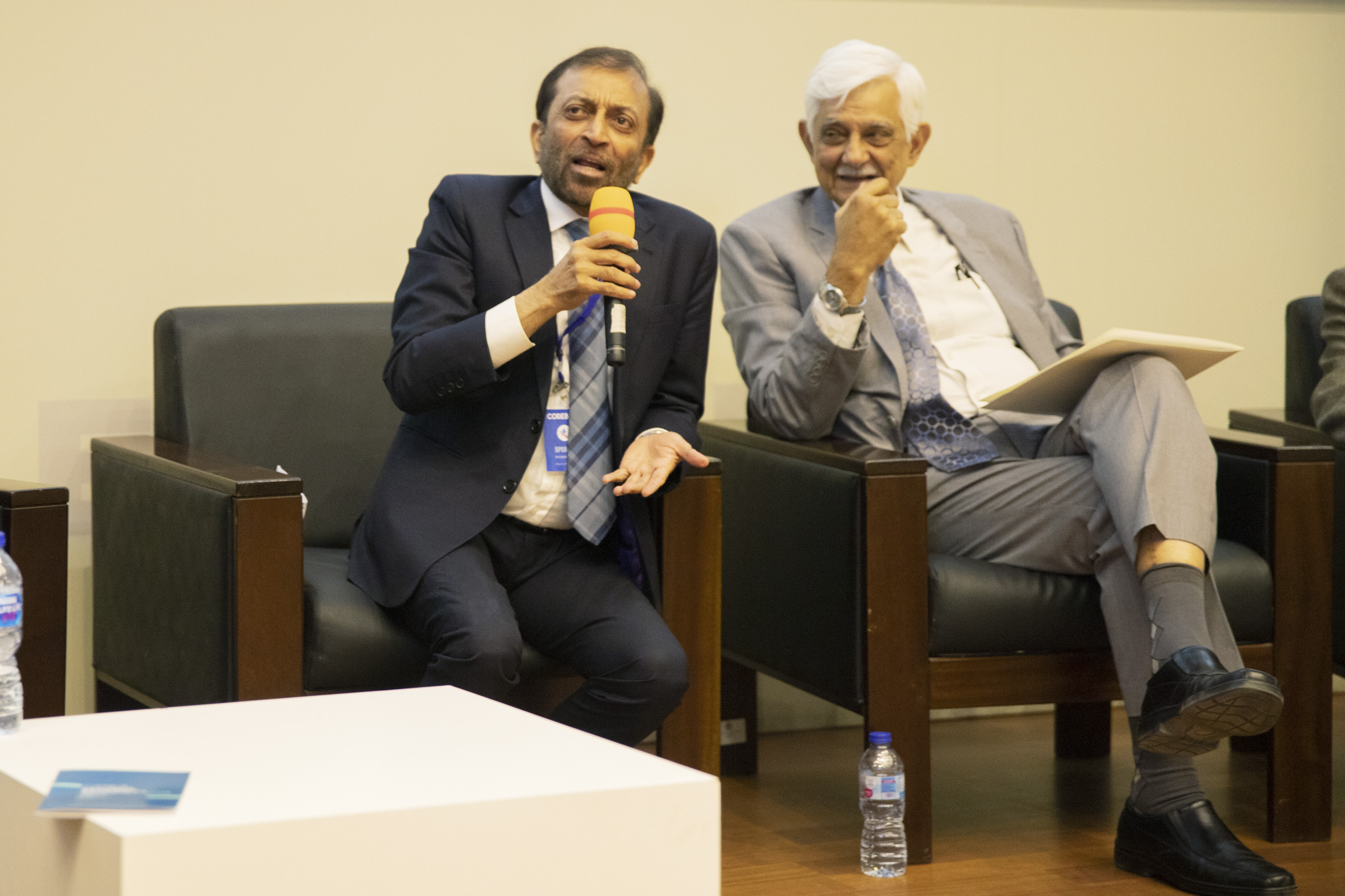 Farooq Sattar and Taj Haider during a panel discussion.