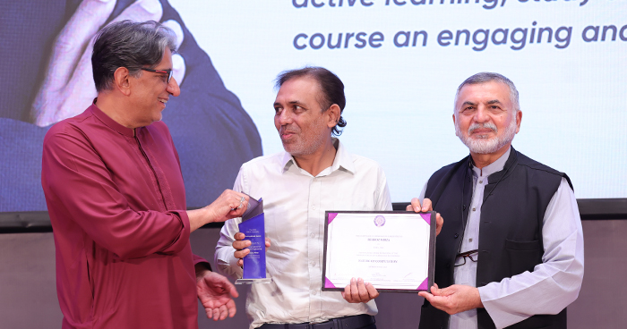 dr behroz mirza receiving teaching excellence award