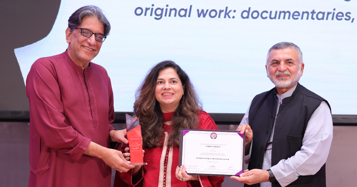 ms. tajreen midhat receiving award 