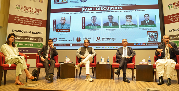 Full panel on stage at IBA Karachi with moderator Dr. S. Akbar Zaidi speaking on teaching in the AI era.