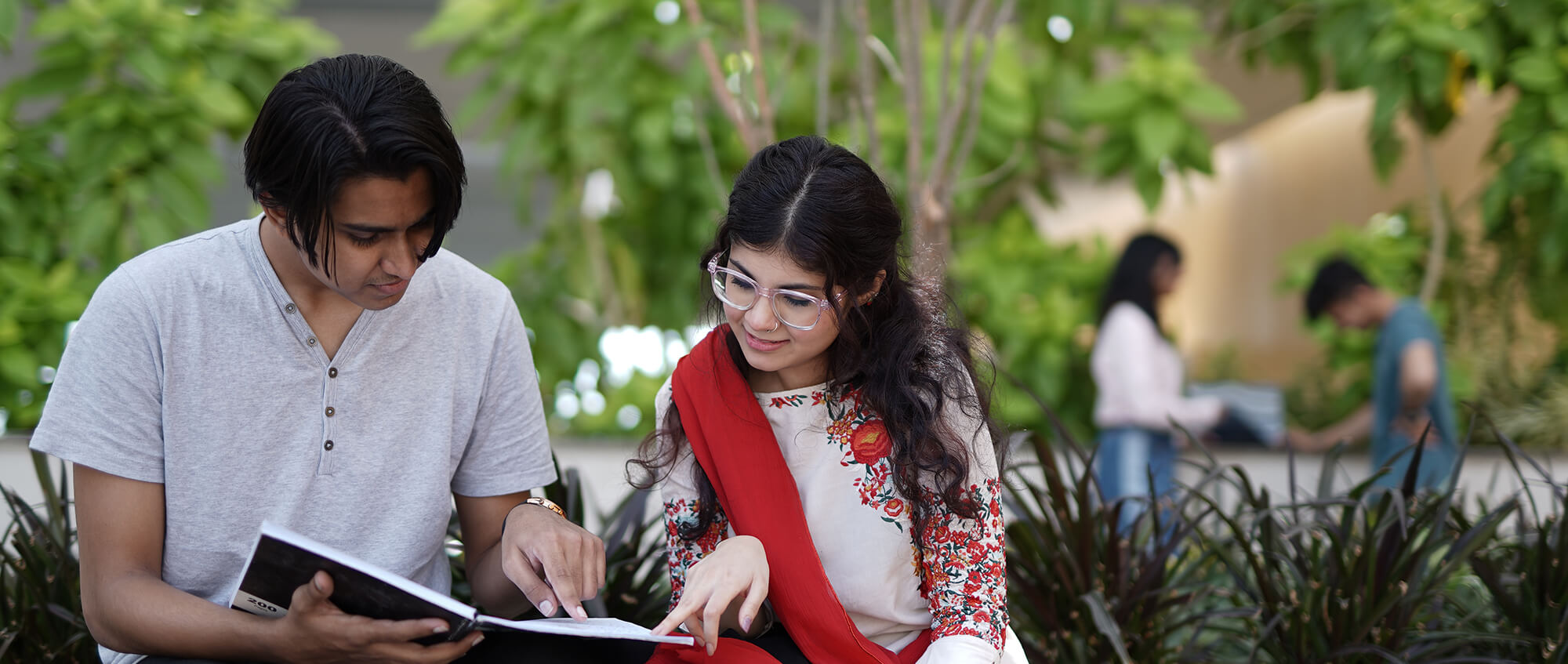 a boy and girl studying