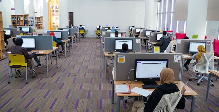 students at habib university accessing learning resources through hu tops scholarships