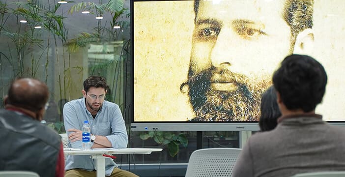 comparative cultural studies seminar featuring a historical figure and classroom discussion