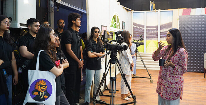 Students learning about media roles while exploring careers in social development.